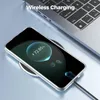 A smartphone is wirelessly charging on a charging pad next to a laptop. Produktbild-Vorschau