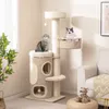 Two cats are playing on a cat tree in a living room. Podgląd zdjęcia produktu