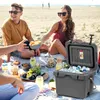 A group of people having a picnic on the beach with a cooler. Náhľad obrázku produktu