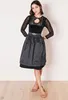 A woman is modeling a dirndl. Produktbild-Vorschau