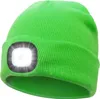 A bright green knitted beanie with a built-in LED light on the front. Produktbild-Vorschau