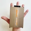 A hand holding a small electronic device. Produktbild-Vorschau