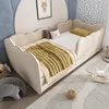 A child's bedroom with a daybed, toys, and decor. Podgląd zdjęcia produktu