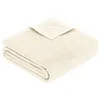 A folded cream-colored blanket on a white background. Produktbild-Vorschau