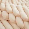 A close-up, angled view of a textured, plush blanket in a light beige color. Produktbild-Vorschau