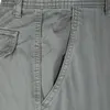 A close-up view of the pocket and stitching on a pair of gray cargo jogging pants. Produktbild-Vorschau
