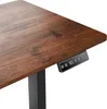 A close-up view of a wooden desk with an electronic control panel. Náhled obrázku produktu