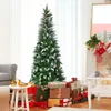 A decorated Christmas tree with gifts underneath, in a room with a fireplace and stockings. Anteprima dell’immagine prodotto