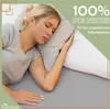 A woman sleeping on a bed with a pillow. Produktbild-Vorschau