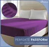 A purple fitted sheet on a bed with two white pillows. Produktbild-Vorschau