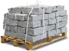 A pallet of granite curb stones on a white background. Produktbild-Vorschau