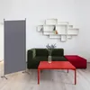 A room divider is shown in a living room setting with a sofa, coffee table, and shelves. Anteprima dell’immagine prodotto