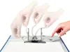A person's hands are shown operating the rings of a binder. Voir les images du produit