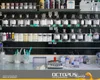 A laboratory or workshop setting with shelves filled with bottles of liquids and powders, and a scale with a test tube on a counter. Produktbild-Vorschau