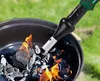 A charcoal grill being lit with a BBQ accessory. Produktbild-Vorschau