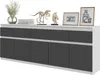A white and dark gray sideboard with decorative items on top. Produktbild-Vorschau