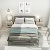 A bedroom scene with a bed, nightstands, and artwork. Produktbild-Vorschau
