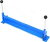 A blue metal sheet bending machine with black handles is shown against a white background. Náhled obrázku produktu