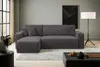 A modern living room with a grey sectional sofa, a coffee table, and a floor lamp. Produktbild-Vorschau