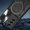 A black phone case with a silver accent is shown at an angle, with rocks and a dark background. Produktbild-Vorschau