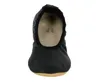 A black leather gymnastic shoe is shown from the front against a white background. Produktbild-Vorschau