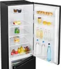 The inside of an open black refrigerator with food items on the shelves and in the door compartments. Podgląd zdjęcia produktu