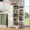 A white kitchen cabinet with its doors open, displaying various food items and kitchenware. The cabinet is placed in a kitchen setting next to a green cabinet and a window. Voir les images du produit