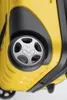A close-up view of the wheel and lower part of a yellow suitcase. Náhľad obrázku produktu