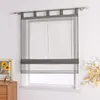A window with a grey sheer Roman shade. Produktbild-Vorschau