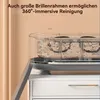 A clear plastic cleaning device filled with water, sitting on top of a white cabinet. The device has multiple compartments inside. Produktbild-Vorschau