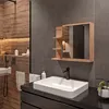 A modern bathroom with a sink, faucet, mirror cabinet, and shower area. Produktbild-Vorschau