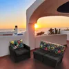 A balcony overlooking the ocean at sunset, with outdoor furniture. Náhled obrázku produktu