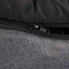 A close-up view of a zipper on a gray fabric product. Produktbild-Vorschau