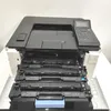 A printer with its toner cartridges exposed. Produktbild-Vorschau