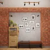 A hallway or entryway with a shoe cabinet, a bench, and framed pictures on the wall. Podgląd zdjęcia produktu