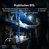A person is using a flashlight in a warehouse with shelves full of boxes. Anteprima dell’immagine prodotto