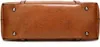 The bottom view of a brown leather handbag with metal studs. Produktbild-Vorschau