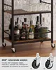 A bar cart with bottles and glasses on shelves, and a close-up of its wheels. Produktbild-Vorschau