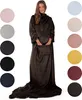A woman modeling a dark brown blanket with sleeves and a front pocket, surrounded by circular swatches of various other blanket colors. Podgląd zdjęcia produktu