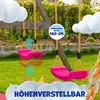 Two pink swings hanging from a wooden swing set in a garden. Produktbild-Vorschau