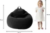 A black beanbag chair is shown next to a young girl, with dimensions indicated by measurement lines and text. Voir les images du produit