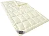 A cream-colored quilted blanket is shown laid out on a white background. Produktbild-Vorschau