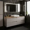 A modern bathroom vanity with a sink and mirror. Anteprima dell’immagine prodotto
