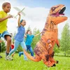 Children playing outdoors with an inflatable T-Rex costume. Produktbild-Vorschau