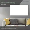 An infrared heater is mounted on a wall above a sofa with decorative pillows. Produktbild-Vorschau