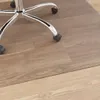 The base of an office chair with wheels on a wooden floor. Produktbild-Vorschau