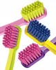 A close-up shot of four colorful toothbrushes on a white background. Náhled obrázku produktu