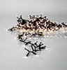 A string of white LED lights on a white and gray background. Podgląd zdjęcia produktu
