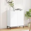 A white sideboard with ribbed doors is shown in a room with light-colored walls and wooden flooring. Podgląd zdjęcia produktu