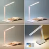 A collage of four images showing a white LED desk lamp with a book, demonstrating different light settings and features. Produktbild-Vorschau